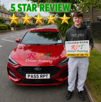 “Smiling new driver from pellon holding pass certificate outside Halifax test centre