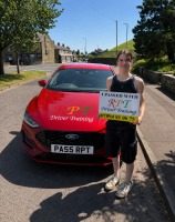 Rosie Hetherington celebrating passing her driving test at Halifax Test Centre with RPT Driver Training in Halifax."