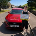 Rosie Hetherington celebrating passing her driving test at Halifax Test Centre with RPT Driver Training in Halifax."